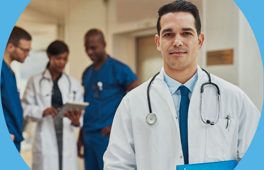 Image of doctor with three other healthcare providers in the background.